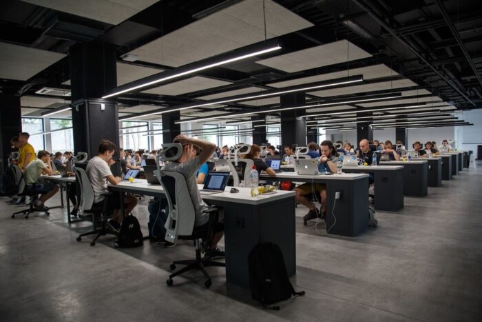 Employees working in an open floor office